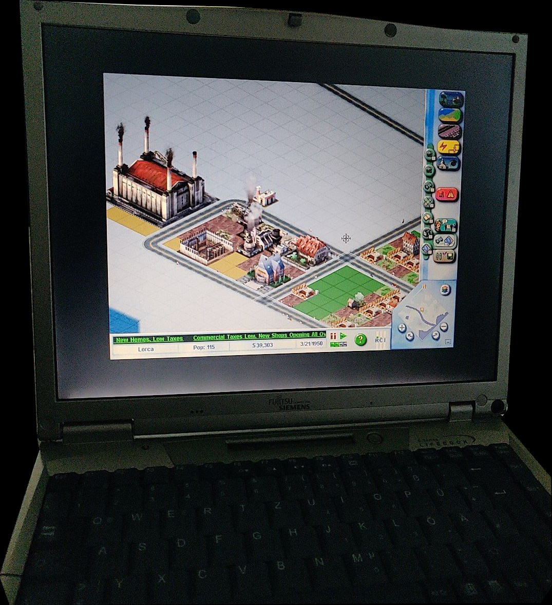 SimCity on the laptop.